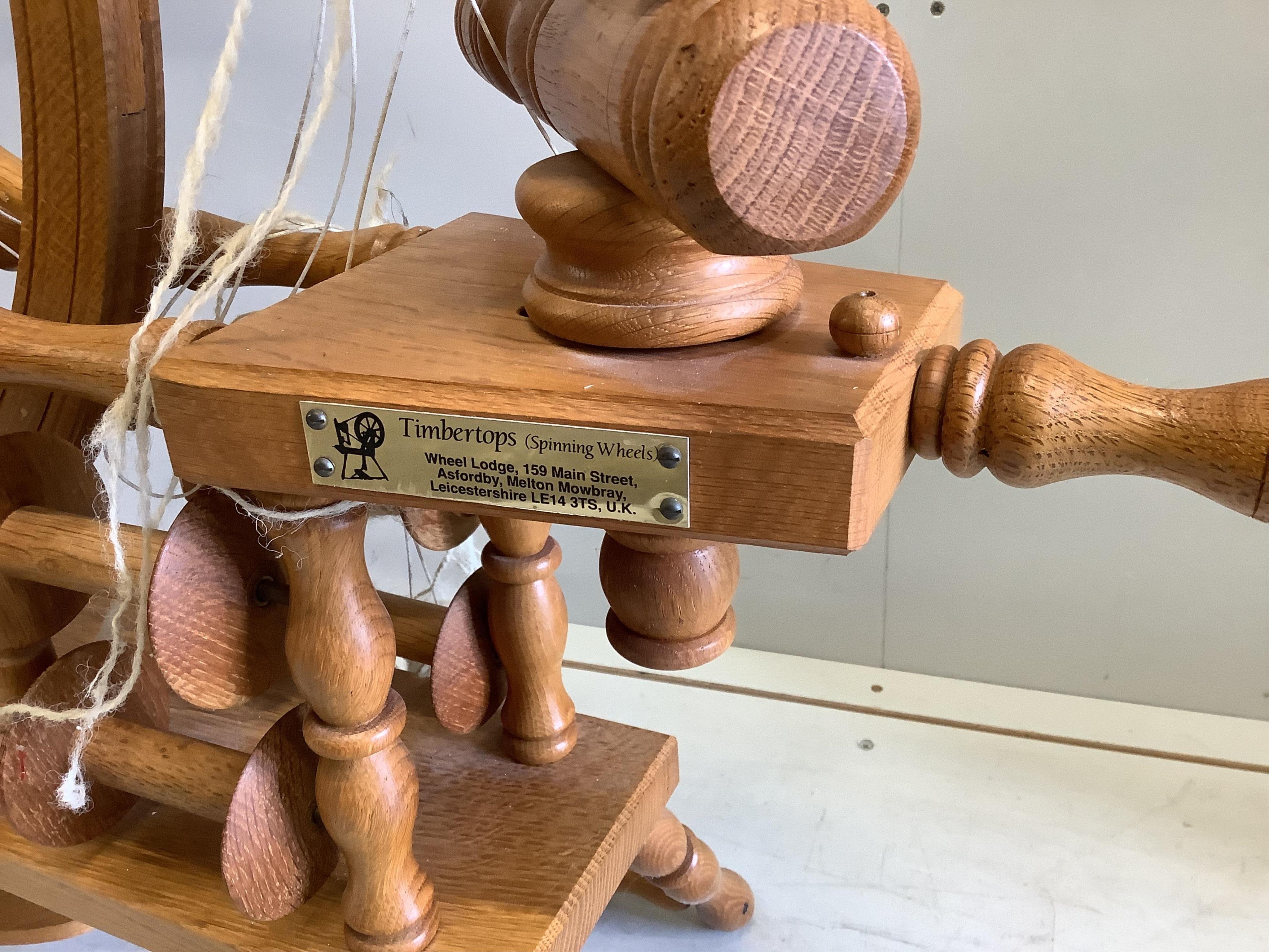 A Timbertops Leicester oak spinning wheel, height 86cm. Condition - good